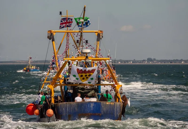Fishing boats and visitors at Maryport Harbour during the traditional trawler race