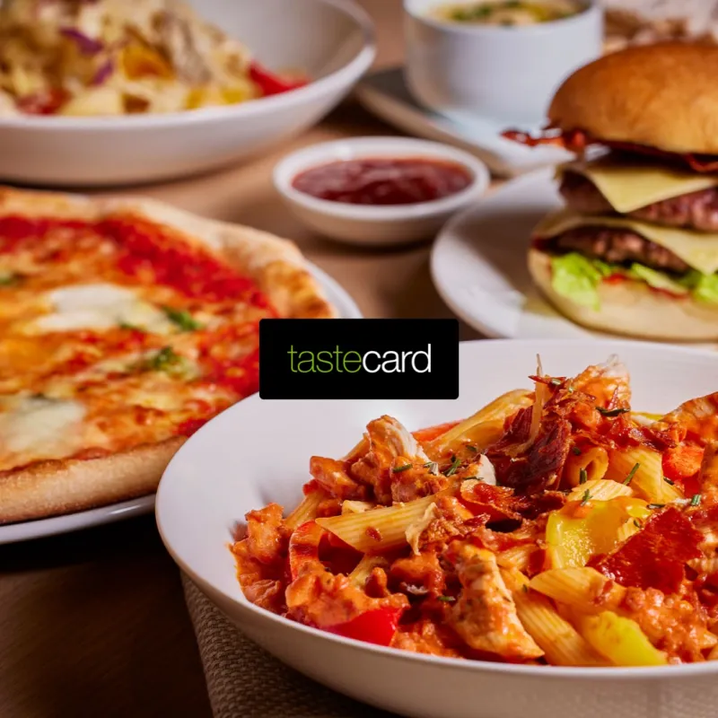 Tastecard-style dining savings in Cumbria with food, coffee and a mobile discount app beside a Lake District view